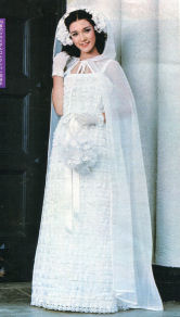 Patricia modeling a White Wedding Dress with Cowl Veil